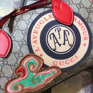 Túi du lịch Gucci nữ màu ghi dây đỏ họa tiết Monogram - Ảnh 4